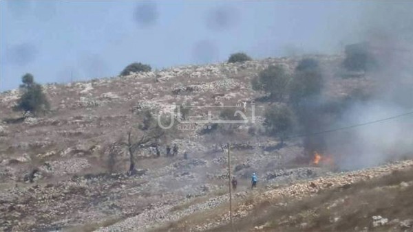 مواجهات بعد قيام مستوطنين بحرق أراض ببورين